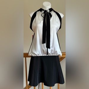 Lauren Vidal Satin White & Black Sleeveless Blouse.Ties In Front Elastic Bottom.